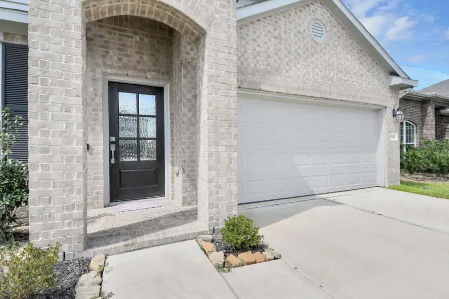 Exterior details and patio area of a home in Willow Trace, Spring (Image 4).