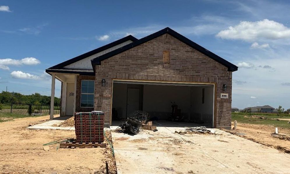 Front exterior of a new home in River Ranch Trails, Dayton, TX, highlighting curb appeal (Image 14). Front exterior of a new home in River Ranch Trails, Dayton, TX, highlighting curb appeal (Image 14).