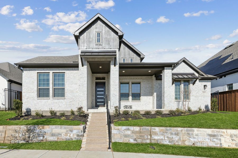 Front exterior of a new home in Karis, Crowley, TX, highlighting curb appeal (Image 2). Front exterior of a new home in Karis, Crowley, TX, highlighting curb appeal (Image 2).