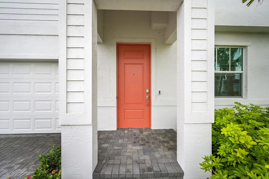Front exterior of a new home in Seagrove: The Indies, Fort Pierce, FL, highlighting curb appeal (Image 1).