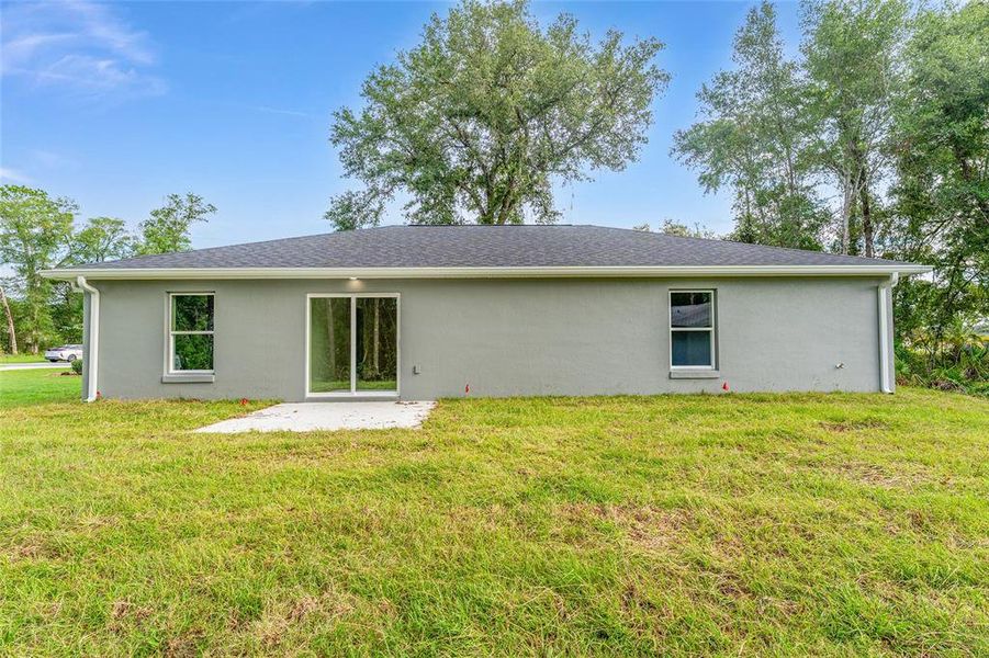 Front exterior of a new home in , Ocklawaha, FL, highlighting curb appeal (Image 22).