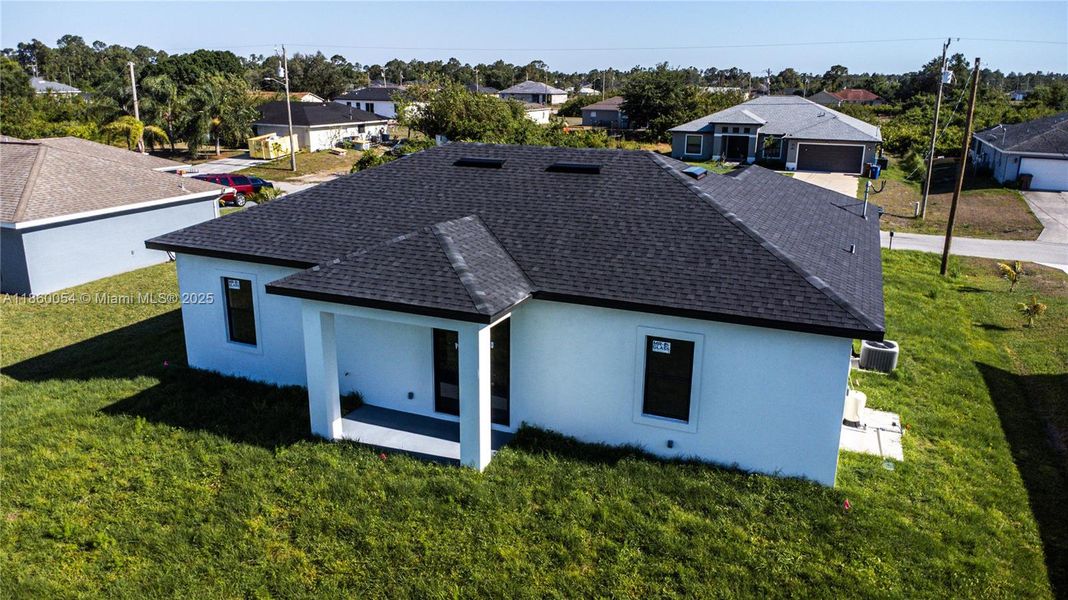 Front exterior of a new home in , Lehigh Acres, FL, highlighting curb appeal (Image 1).