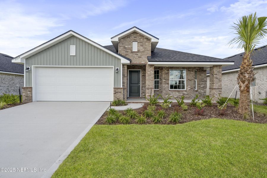 Front exterior of a new home in Shadow Crest at Rolling Hills, Green Cove Springs, FL, highlighting curb appeal (Image 18). Front exterior of a new home in Shadow Crest at Rolling Hills, Green Cove Springs, FL, highlighting curb appeal (Image 18).