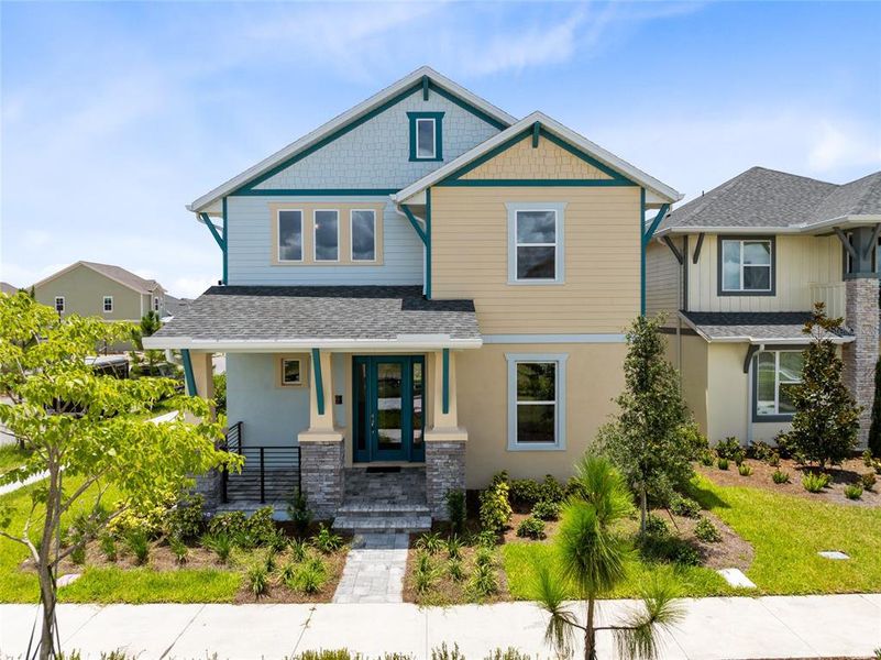 Front exterior of a new home in , Orlando, FL, highlighting curb appeal (Image 24).