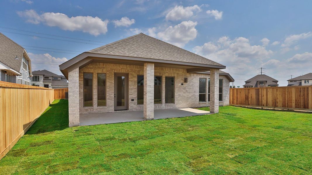 Front exterior of a new home in Bridgeland 55', Cypress, TX, highlighting curb appeal (Image 2). Front exterior of a new home in Bridgeland 55', Cypress, TX, highlighting curb appeal (Image 2).