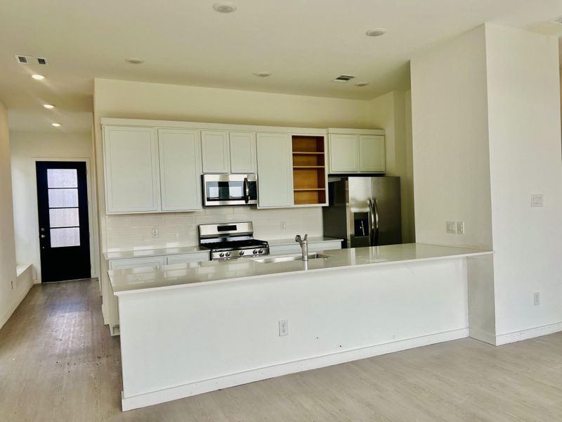 Furnished interior view inside a new home in Bridgeland, Cypress (Image 11).