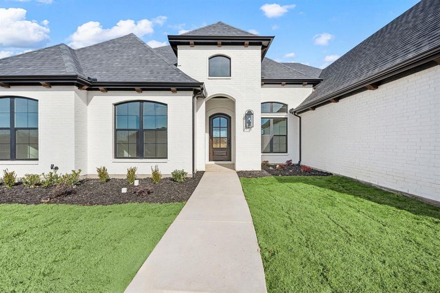 Front exterior of a new home in , Haslet, TX, highlighting curb appeal (Image 23). Front exterior of a new home in , Haslet, TX, highlighting curb appeal (Image 23).