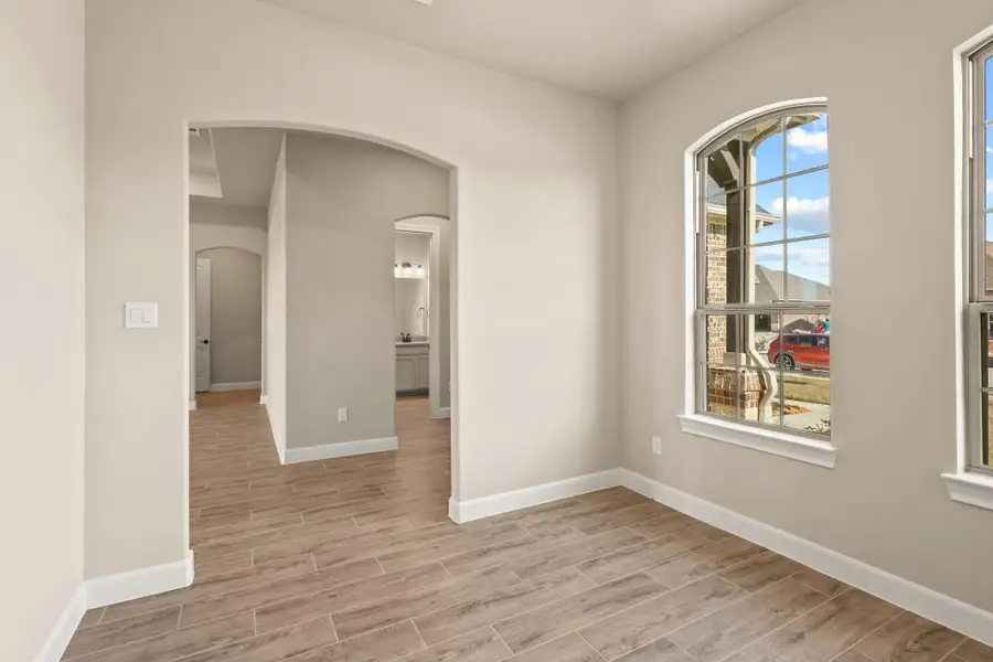 The dedicated home office features large windows that fill the space with natural light, creating a bright and inspiring environment perfect for productivity and focus. The dedicated home office features large windows that fill the space with natural light, creating a bright and inspiring environment perfect for productivity and focus.