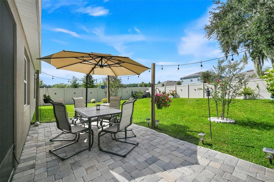 Exterior details and patio area of a home in Windrose, Apopka (Image 3).