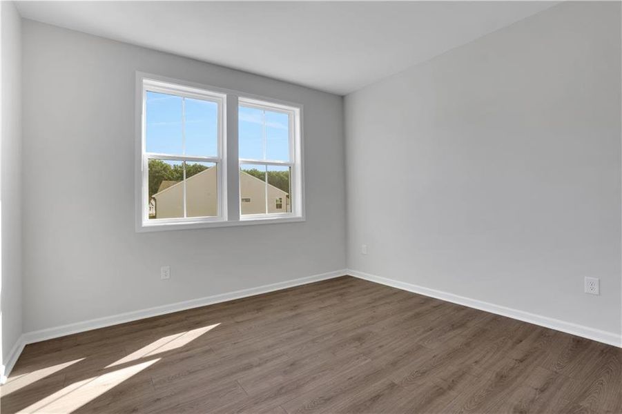 Spacious, unfurnished interior of a new home in The Paddocks at Doc Hughes, Buford (Image 40).