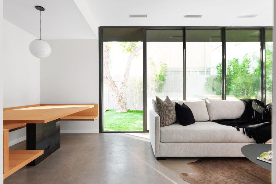 Living room with concrete floors and baseboards Living room with concrete floors and baseboards