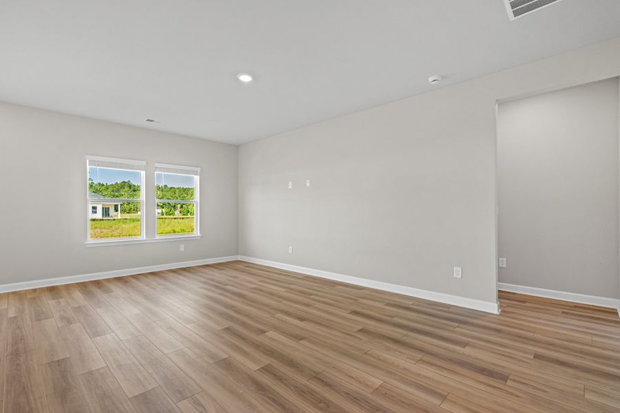Spacious, unfurnished interior of a new home in Cypress Ridge - The Boardwalk Series, Longs (Image 11).