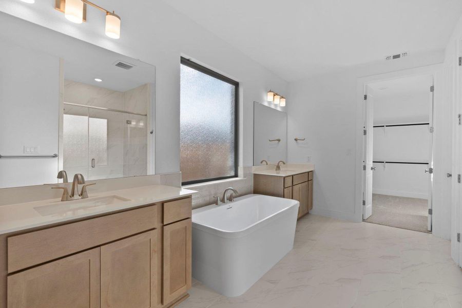 Primary Bath retreat with dual vanities & soaking tub Primary Bath retreat with dual vanities & soaking tub