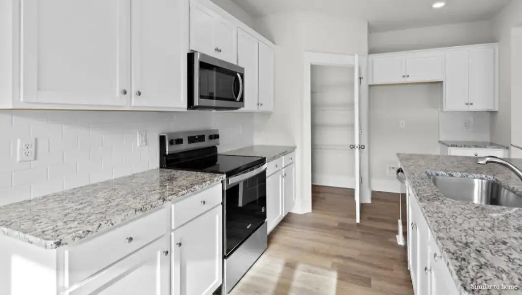 Furnished interior view inside a new home in The Highlands at Cedar Hill Landing, Navassa (Image 8).