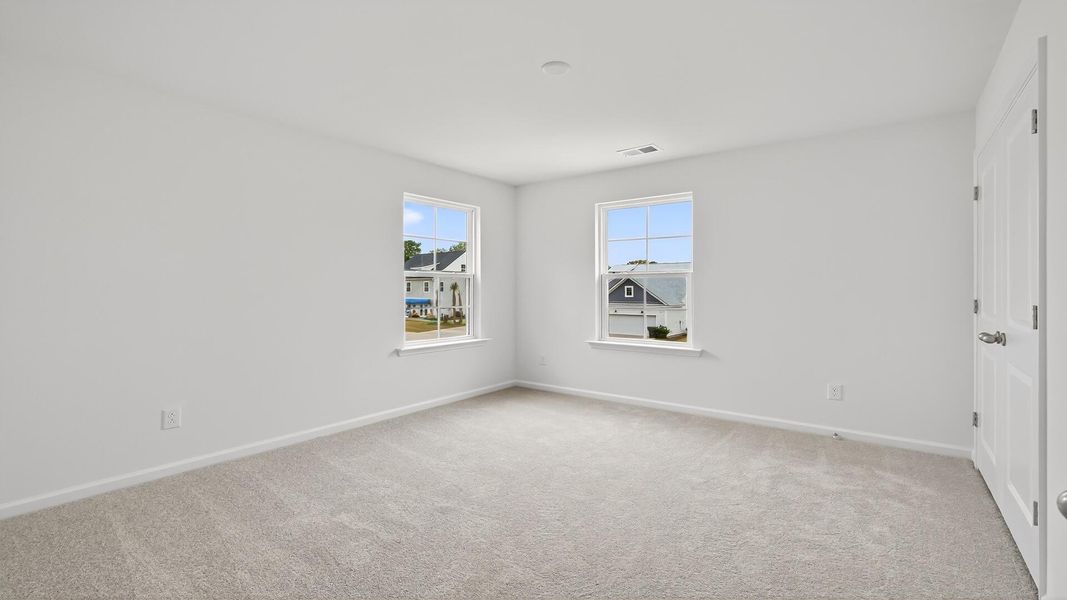 Spacious, unfurnished interior of a new home in Creekside at Andrews, Summerville (Image 19).