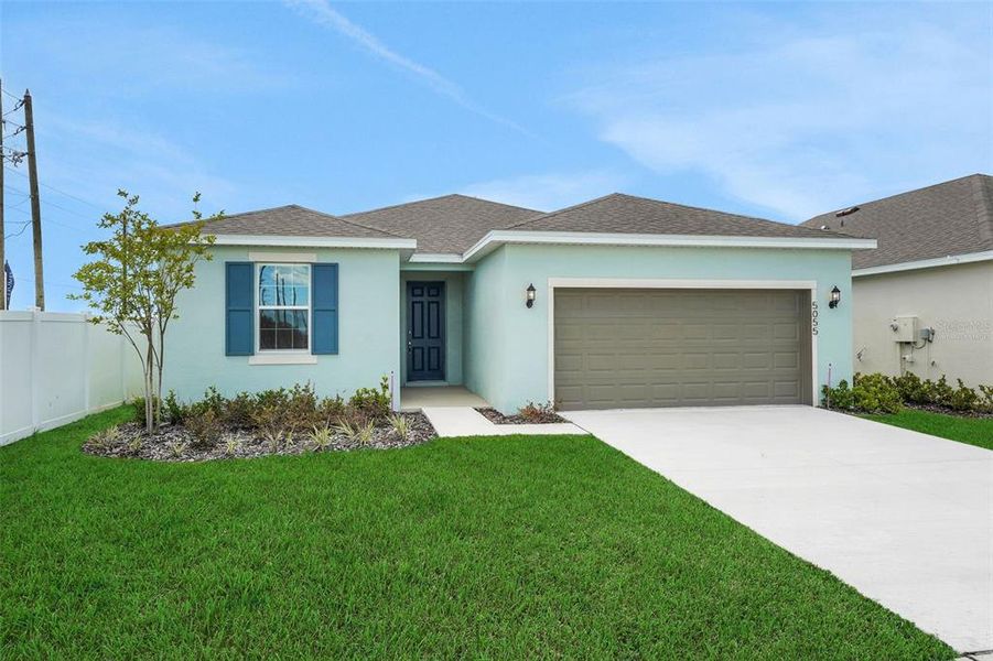 Front exterior of a new home in Annabelle Estates, Winter Haven, FL, highlighting curb appeal (Image 18).