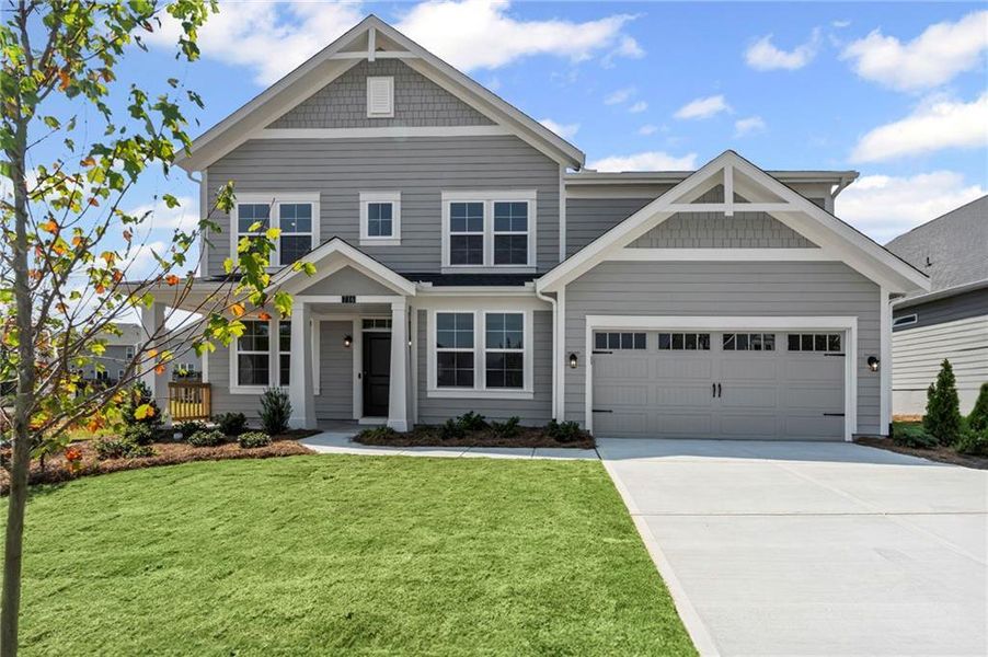 Front exterior of a new home in Twin Lakes, Hoschton, GA, highlighting curb appeal (Image 2). Front exterior of a new home in Twin Lakes, Hoschton, GA, highlighting curb appeal (Image 2).