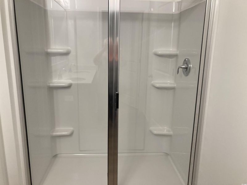 Full bath featuring a stall shower