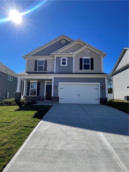 Exterior details and patio area of a home in Springwood Grove, Central (Image 2).