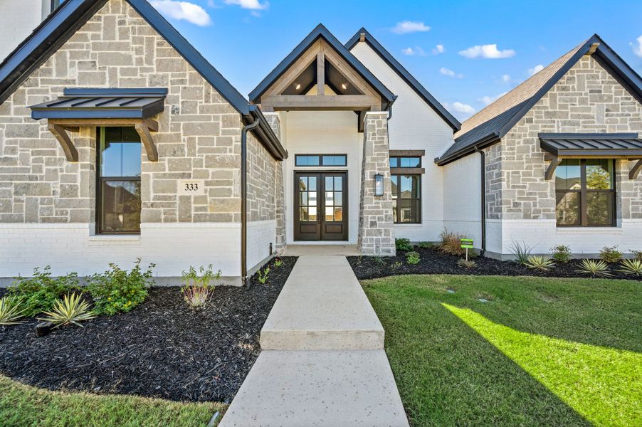 Front exterior of a new home in NorthGlen, Haslet, TX, highlighting curb appeal (Image 29).
