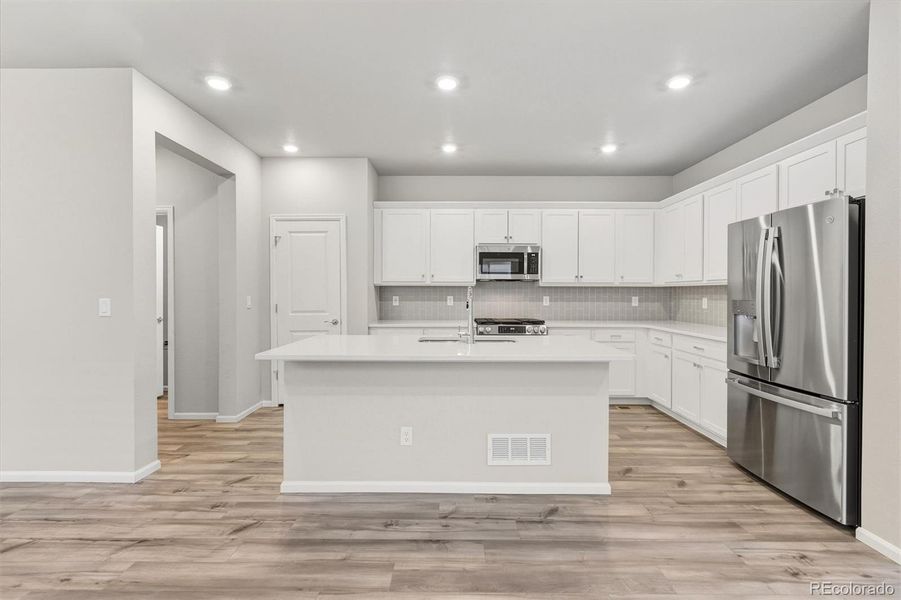Furnished interior view inside a new home in Woodrose at Painted Prairie, Aurora (Image 4).