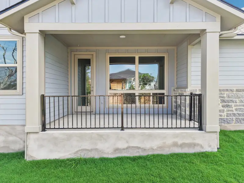 View of exterior entry featuring board and batten siding