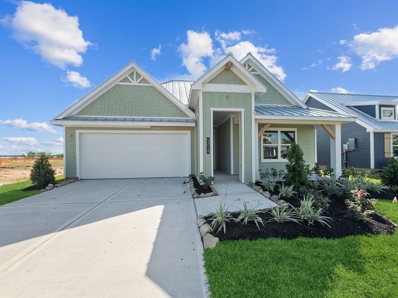 Front exterior of a new home in Grand Cay Harbour, Texas City, TX, highlighting curb appeal (Image 24). Front exterior of a new home in Grand Cay Harbour, Texas City, TX, highlighting curb appeal (Image 24).