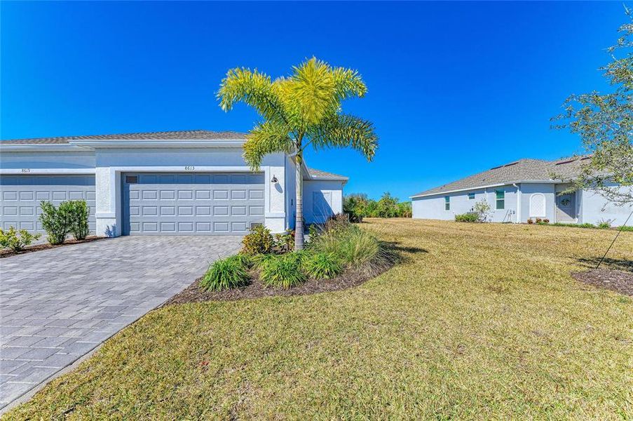Front exterior of a new home in , Englewood, FL, highlighting curb appeal (Image 23). Front exterior of a new home in , Englewood, FL, highlighting curb appeal (Image 23).