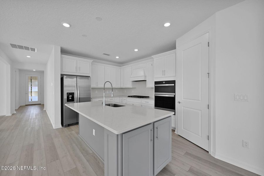 Furnished interior view inside a new home in Del Webb Wildlight, Yulee (Image 6).