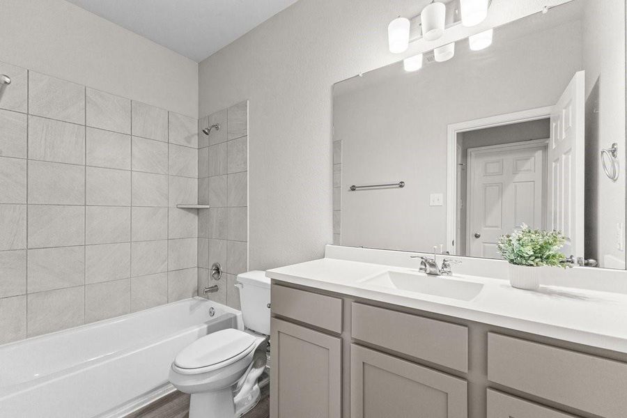 Furnished interior view inside a new home in Mill Creek Trails, Magnolia (Image 12).