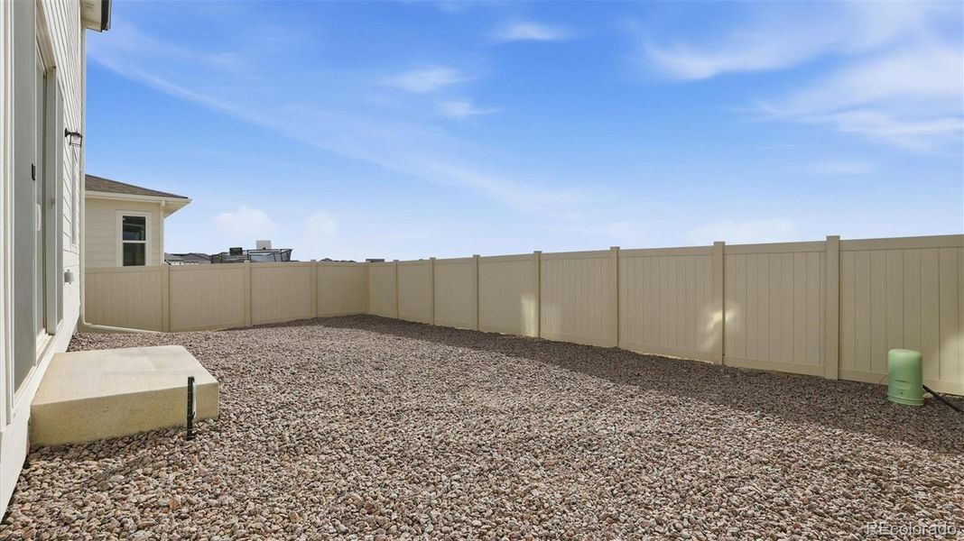 Spacious fenced backyard for outdoor fun and relaxation.