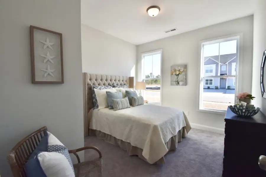 Furnished interior in a model home at Parkwood Estates in Leland (Image 19).