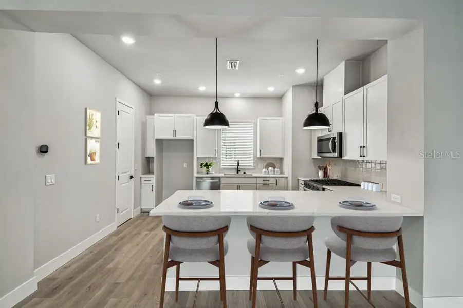 Furnished interior view inside a new home in Towns at Union, St. Petersburg (Image 7).