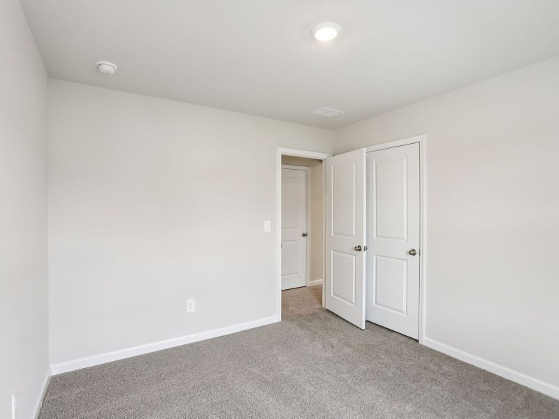 Spacious, unfurnished interior of a new home in Hawthorne Station, College Park (Image 20).