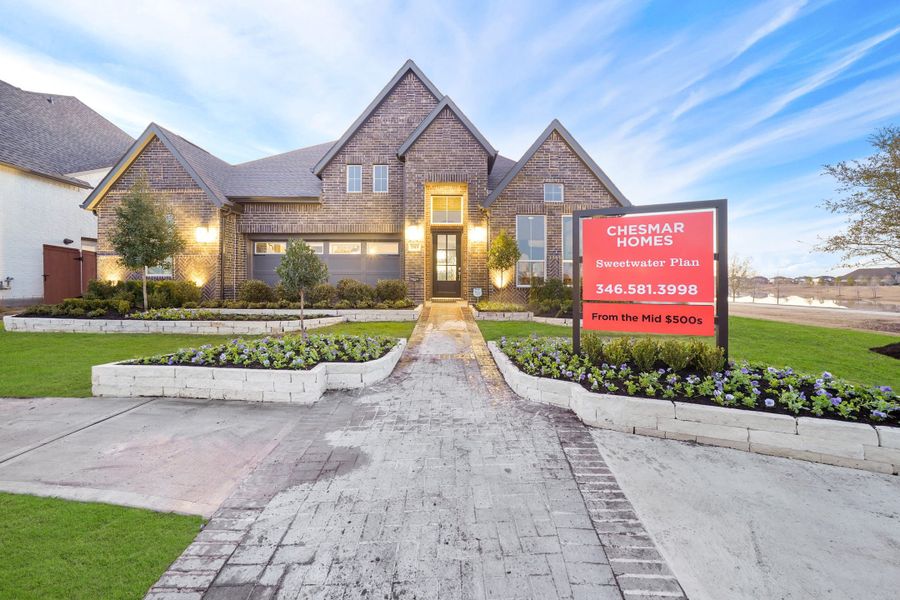 Front exterior of a new home in Elyson, Katy, TX, highlighting curb appeal (Image 20).
