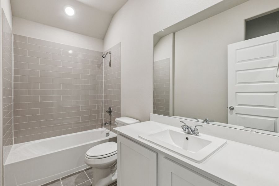 Bathroom in the Heisman home plan by Trophy Signature Homes – REPRESENTATIVE PHOTO Bathroom in the Heisman home plan by Trophy Signature Homes – REPRESENTATIVE PHOTO