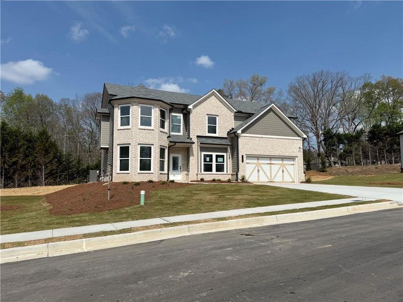 Front exterior of a new home in , Hoschton, GA, highlighting curb appeal (Image 8). Front exterior of a new home in , Hoschton, GA, highlighting curb appeal (Image 8).