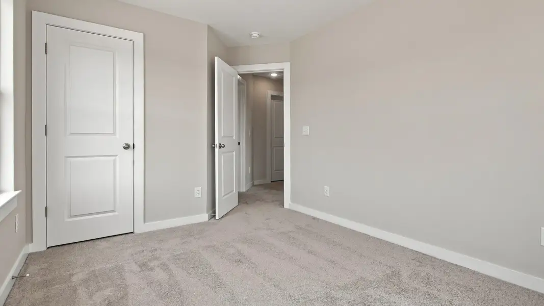 Secondary closet and room entryway from windows
