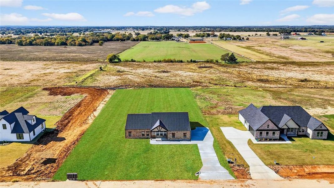 Front exterior of a new home in , Whitewright, TX, highlighting curb appeal (Image 26).