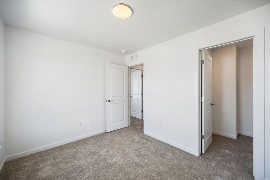 Spacious, unfurnished interior of a new home in Lyric at RidgeGate Townhomes, Lone Tree (Image 23). Spacious, unfurnished interior of a new home in Lyric at RidgeGate Townhomes, Lone Tree (Image 23).