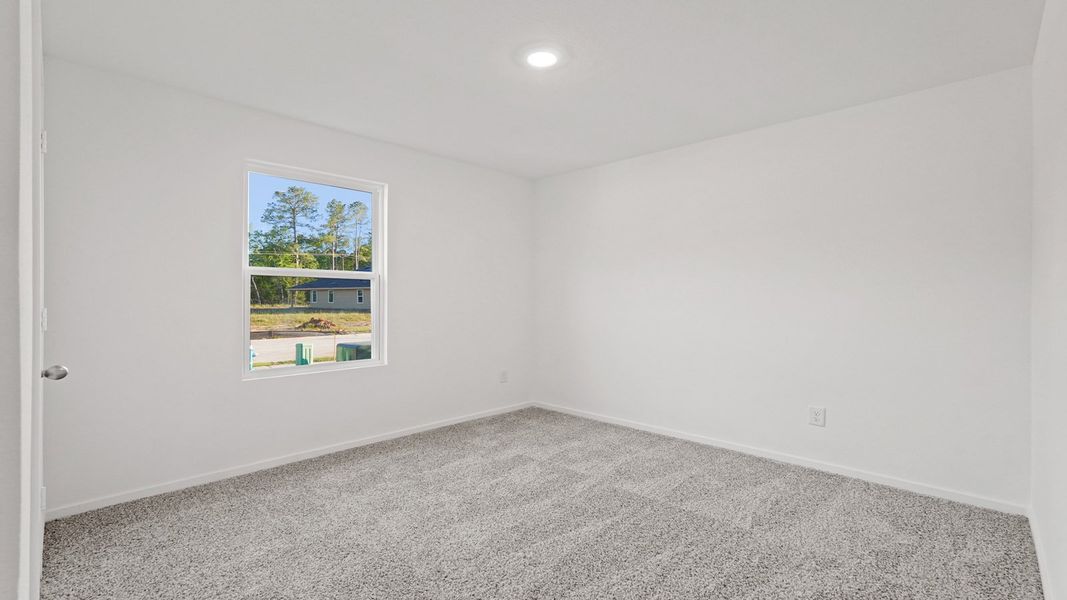 Representative unfurnished interior of a home built from the Lakeway by D.R. Horton in New Waverly Station, New Waverly (Image 19).