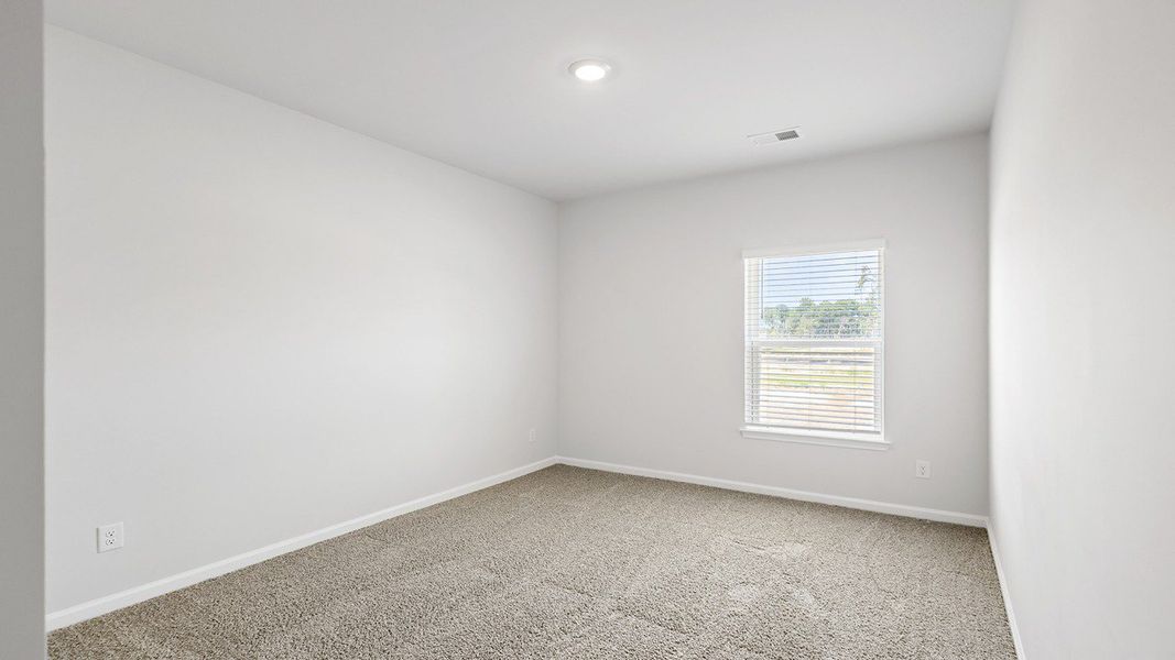 Spacious, unfurnished interior of a new home in The Crossing at St. James, Summerville (Image 23).