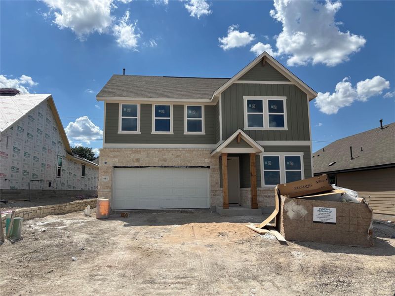 Front exterior of a new home in Covered Bridge, Hutto, TX, highlighting curb appeal (Image 2). Front exterior of a new home in Covered Bridge, Hutto, TX, highlighting curb appeal (Image 2).