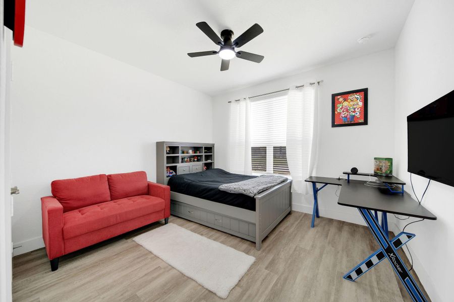 The first of two secondary bedrooms is situated at the front of the home.