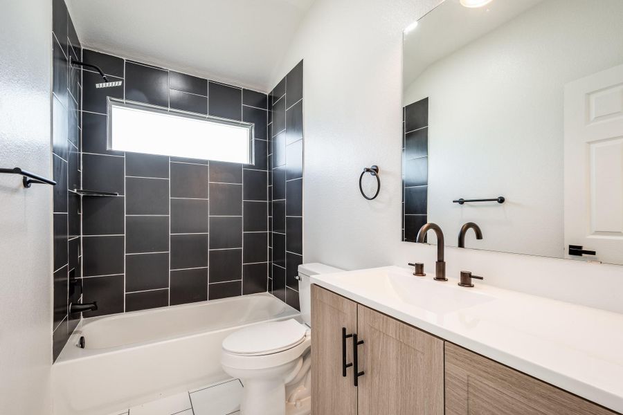Second Bathroom and notice tub tile goes to the ceiling. Second Bathroom and notice tub tile goes to the ceiling.