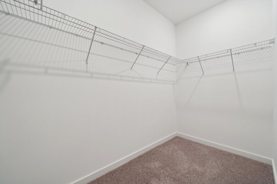 A white wall with a carpet. A white wall with a carpet.