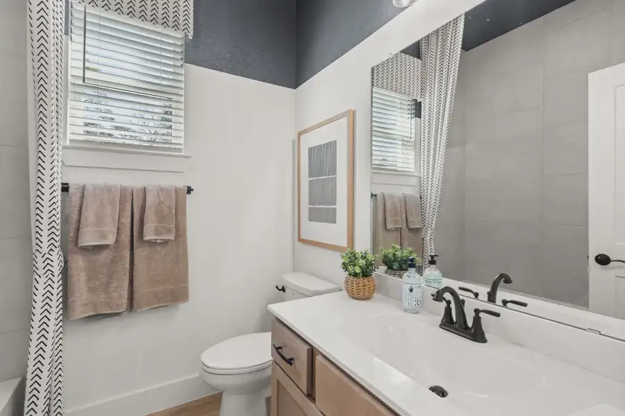 Representative furnished interior of a home built from the Athens by Chesmar Homes in The Woodlands Hills, Willis (Image 9).