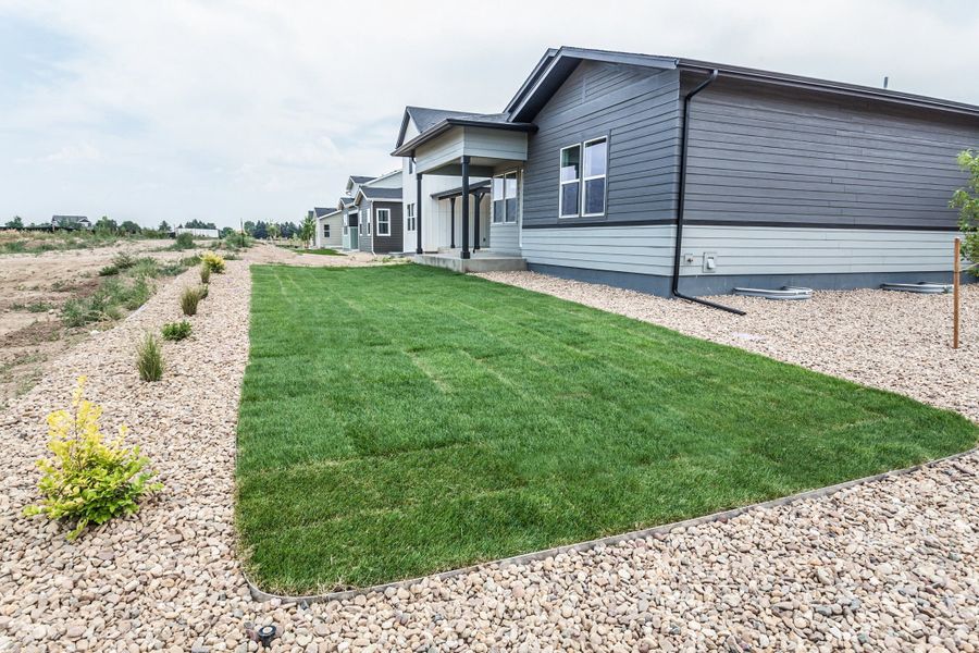 Exterior details and patio area of a home in Prairie Song, Windsor (Image 33).