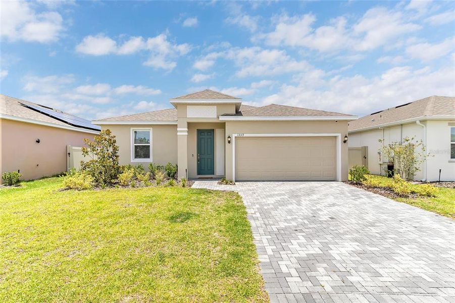 Front exterior of a new home in Tarpon Bay, Haines City, FL, highlighting curb appeal (Image 22). Front exterior of a new home in Tarpon Bay, Haines City, FL, highlighting curb appeal (Image 22).