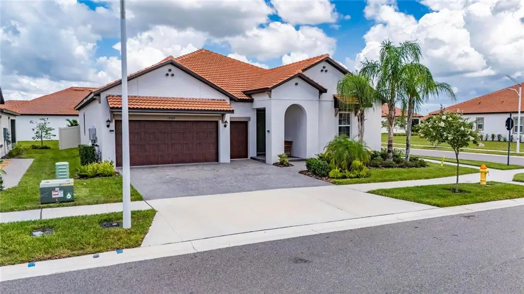 Front exterior of a new home in Southshore Bay Active Adult, Wimauma, FL, highlighting curb appeal (Image 30).